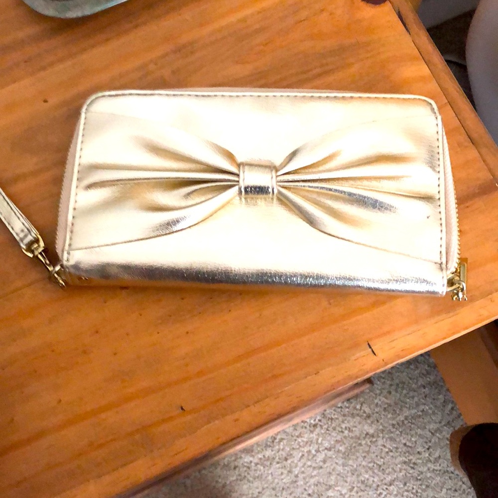 Gold wristlet never used!
